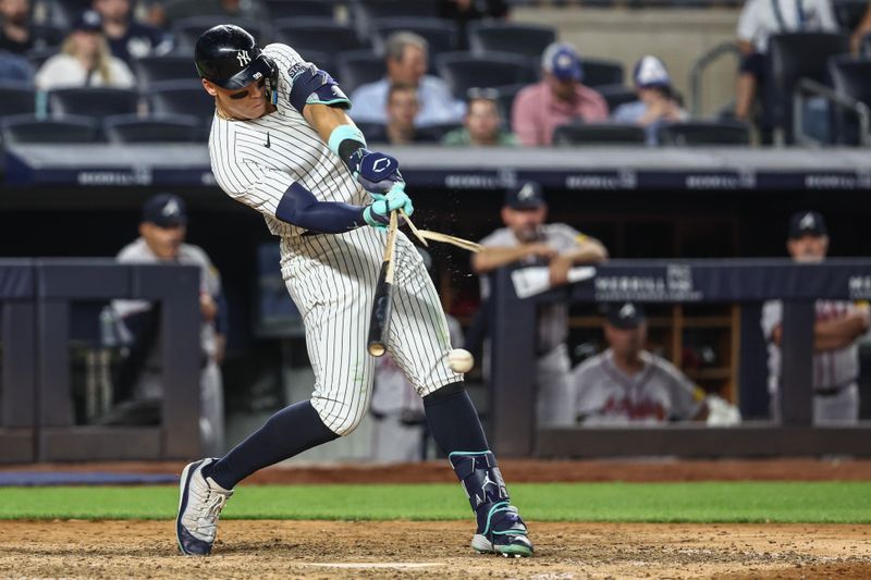 Jun 21, 2024; Bronx, New York, USA; New York Yankees center fielder Aaron Judge (99) breaks his bat in the ninth inning against the Atlanta Braves at Yankee Stadium. Mandatory Credit: Wendell Cruz-USA TODAY Sports