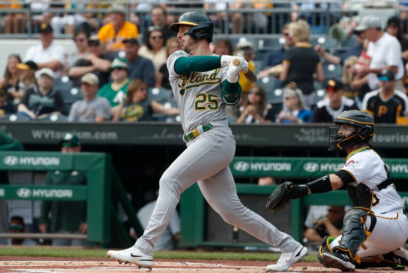 Jun 7, 2023; Pittsburgh, Pennsylvania, USA;  Oakland Athletics designated hitter Brent Rooker (25) hits a RBI single against the Pittsburgh Pirates during the first inning at PNC Park. Mandatory Credit: Charles LeClaire-USA TODAY Sports