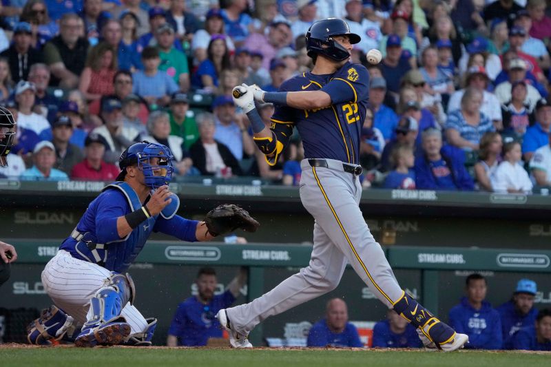 Mar 12, 2024; Mesa, Arizona, USA; Milwaukee Brewers left fielder Christian Yelich (22) hits against the Chicago Cubs in the first inning at Sloan Park. Mandatory Credit: Rick Scuteri-USA TODAY Sports