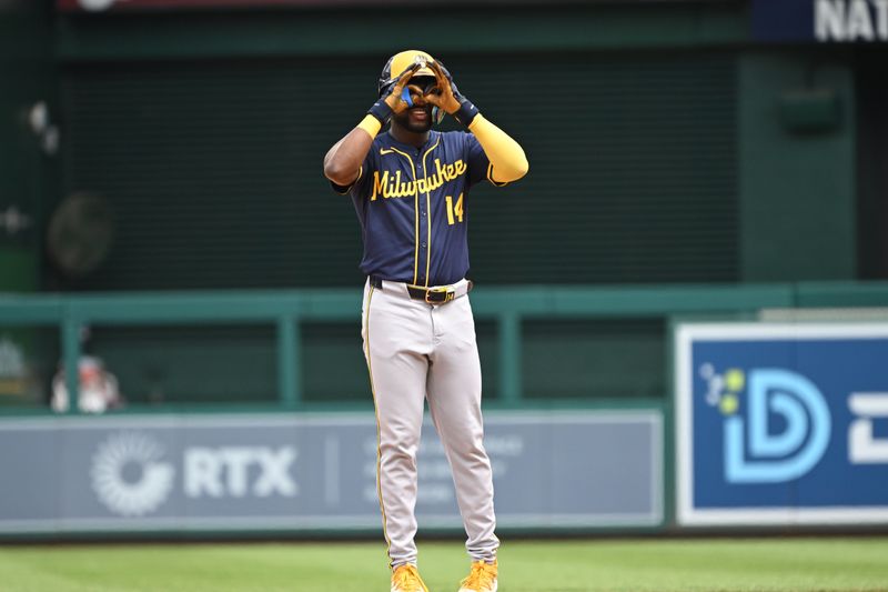 Aug 4, 2024; Washington, District of Columbia, USA; Milwaukee Brewers third baseman Andruw Monasterio (14) reacts after hitting a double against the Washington Nationals during the fifth inning at Nationals Park. Mandatory Credit: Rafael Suanes-USA TODAY Sports