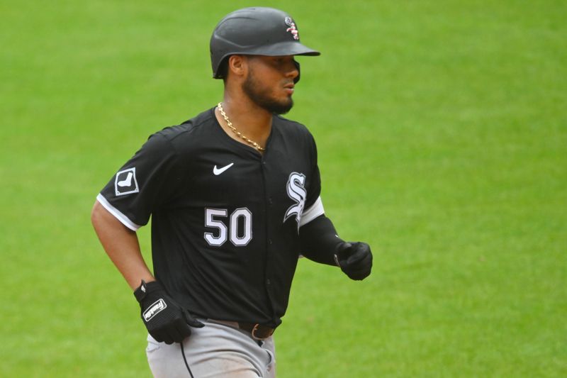 Jul 4, 2024; Cleveland, Ohio, USA; Chicago White Sox third baseman Lenyn Sosa (50) rounds the bases on his solo home run in the ninth inning against the Cleveland Guardians at Progressive Field. Mandatory Credit: David Richard-USA TODAY Sports