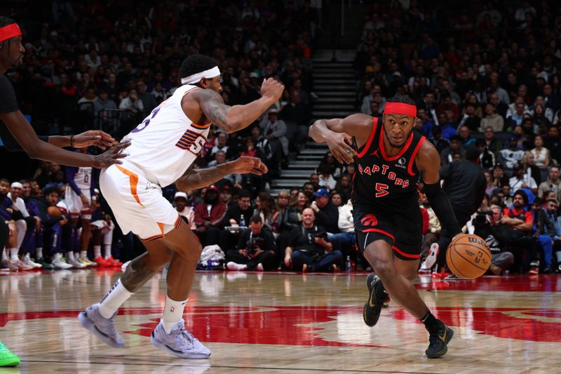 TORONTO, CANADA - FEBRUARY 23: Immanuel Quickley #5 of the Toronto Raptors drives to the basket during the game against the Phoenix Suns on February 23, 2025 at the Scotiabank Arena in Toronto, Ontario, Canada.  NOTE TO USER: User expressly acknowledges and agrees that, by downloading and or using this Photograph, user is consenting to the terms and conditions of the Getty Images License Agreement.  Mandatory Copyright Notice: Copyright 2025 NBAE (Photo by Vaughn Ridley/NBAE via Getty Images)