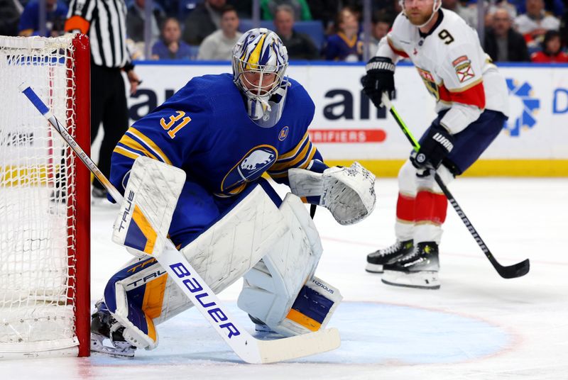 Feb 15, 2024; Buffalo, New York, USA;  Buffalo Sabres goaltender Eric Comrie (31) looks for the puck during the third period against the Florida Panthers at KeyBank Center. Mandatory Credit: Timothy T. Ludwig-USA TODAY Sports