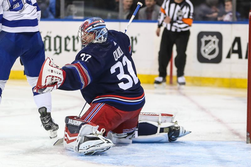 Feb 7, 2024; New York, New York, USA; New York Rangers goaltender Jonathan Quick (32) makes a save on a shot on goal attempt in the first period against the Tampa Bay Lightning at Madison Square Garden. Mandatory Credit: Wendell Cruz-USA TODAY Sports