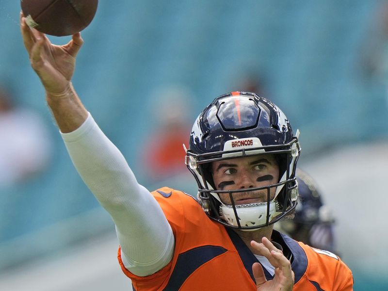 Denver Broncos quarterback Jarrett Stidham warms up before the start of an NFL football game against the Miami Dolphins, Sunday, Sept. 24, 2023, in Miami Gardens, Fla. (AP Photo/Wilfredo Lee)