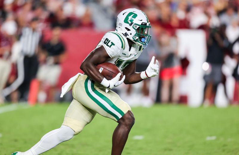 Sep 24, 2022; Columbia, South Carolina, USA; Charlotte 49ers running back Shadrick Byrd (13) rushes against the South Carolina Gamecocks in the first quarter at Williams-Brice Stadium. Mandatory Credit: Jeff Blake-USA TODAY Sports