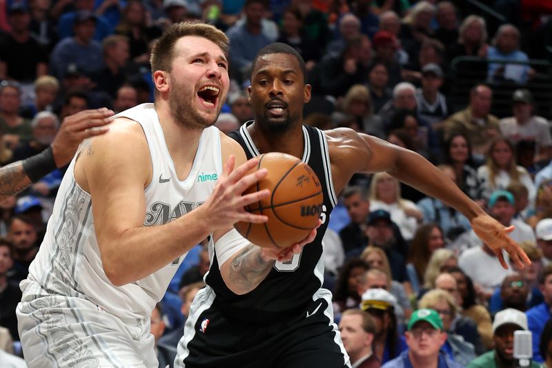 DALLAS, TEXAS - NOVEMBER 16: Luka Doncic #77 of the Dallas Mavericks looks for a shot against Harrison Barnes #40 of the San Antonio Spurs in the second half of an NBA game at American Airlines Center on November 16, 2024 in Dallas, Texas. NOTE TO USER: User expressly acknowledges and agrees that, by downloading and or using this photograph, User is consenting to the terms and conditions of the Getty Images License Agreement. (Photo by Richard Rodriguez/Getty Images)