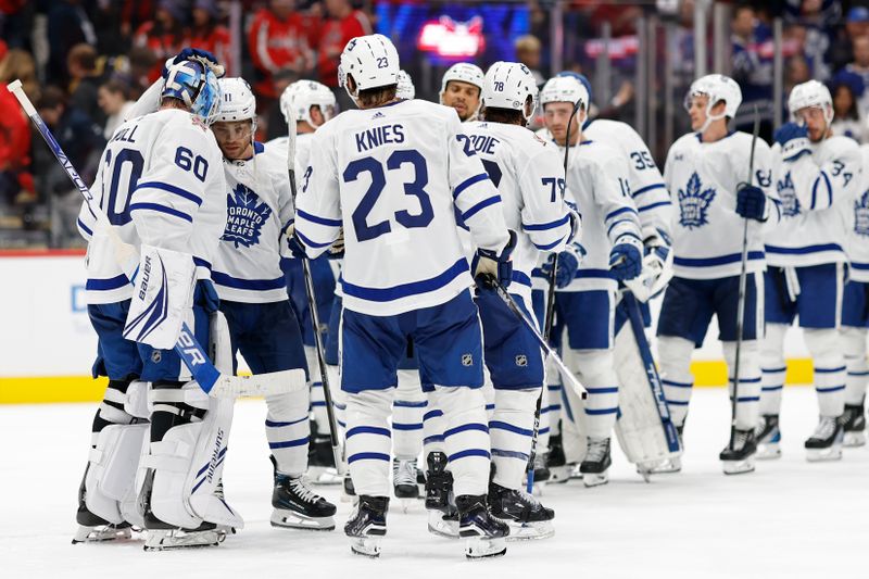 Oct 24, 2023; Washington, District of Columbia, USA; Toronto Maple Leafs goaltender Joseph Woll (60) celebrates with teammates after their game against the Washington Capitals at Capital One Arena. Mandatory Credit: Geoff Burke-USA TODAY Sports