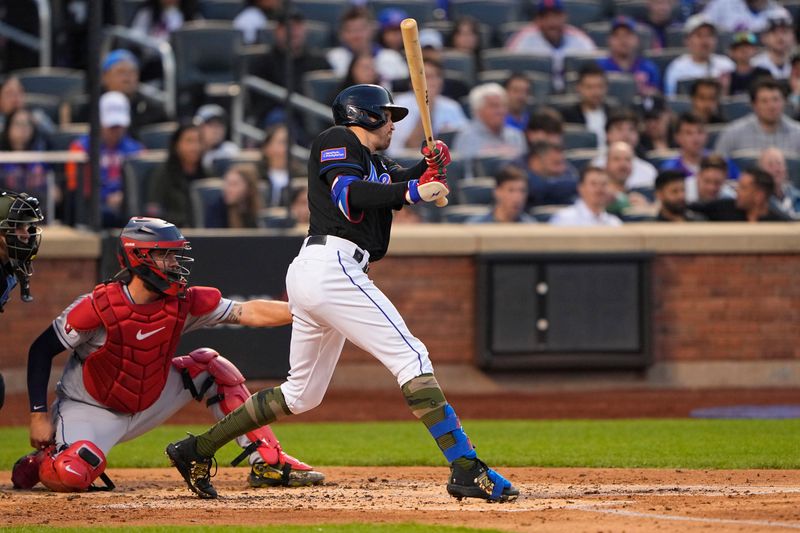 May 21, 2023; New York City, New York, USA; New York Mets center fielder Brandon Nimmo (9) hits a single against the Cleveland Guardians during the third inning at Citi Field. Mandatory Credit: Gregory Fisher-USA TODAY Sports