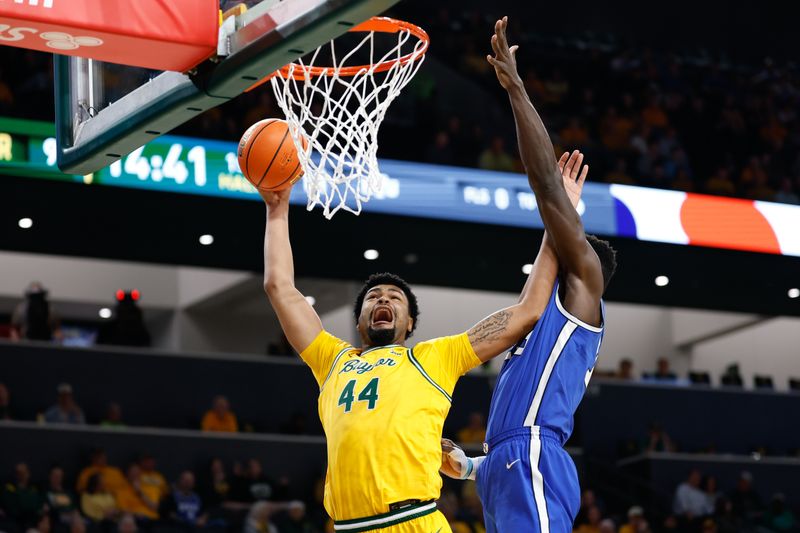 Feb 10, 2026; Waco, Texas, USA;  Baylor Bears center Caden Powell (44) shoots as BYU Cougars center Keba Keita (13) defends during the first half at Paul and Alejandra Foster Pavilion. Mandatory Credit: Chris Jones-Imagn Images