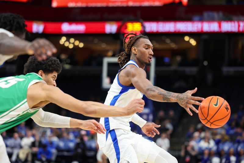 Dec 31, 2025; Memphis, Tennessee, USA; Memphis Tigers guard Zach Davis (2) and North Texas Mean Green forward Reece Robinson (15) reach for a loose ball during the second half at FedExForum. Mandatory Credit: Wesley Hale-Imagn Images