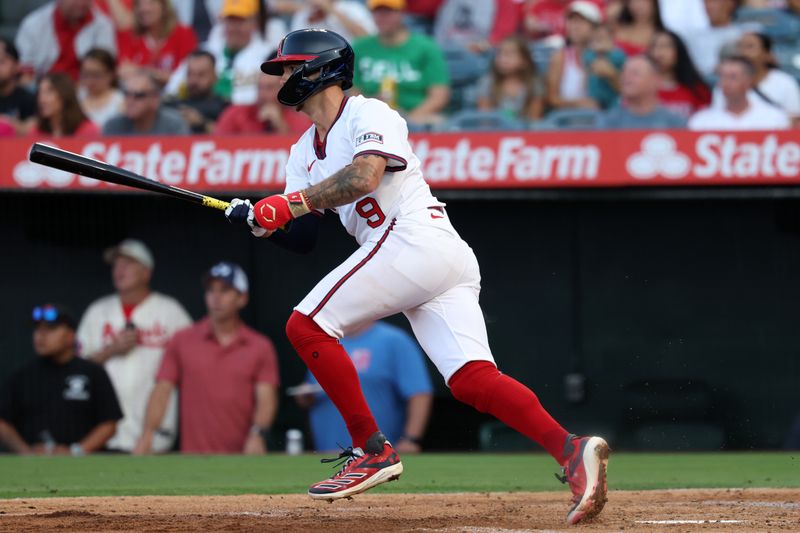 Jul 25, 2024; Anaheim, California, USA;  Los Angeles Angels shortstop Zach Neto (9) hits an RBI single during the second inning against the Oakland Athletics at Angel Stadium. Mandatory Credit: Kiyoshi Mio-USA TODAY Sports