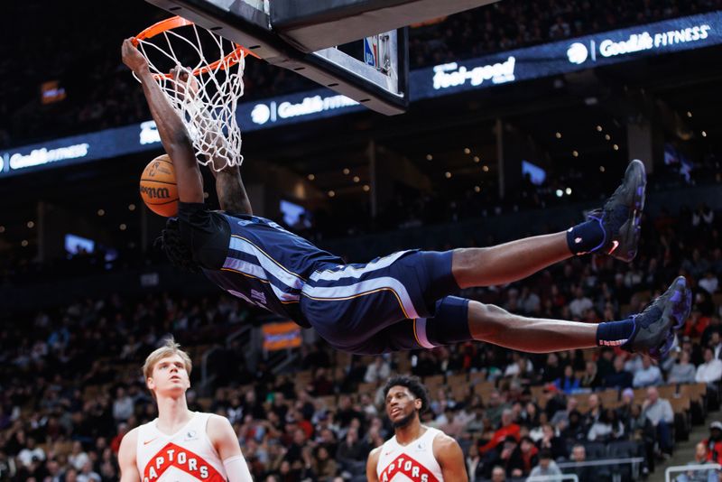 TORONTO, CANADA - JANUARY 22: Vince Williams Jr. #5 of the Memphis Grizzlies dunks against the Toronto Raptors during the second half at Scotiabank Arena on January 22, 2024 in Toronto, Canada. NOTE TO USER: User expressly acknowledges and agrees that, by downloading and or using this photograph, User is consenting to the terms and conditions of the Getty Images License Agreement. (Photo by Cole Burston/Getty Images)