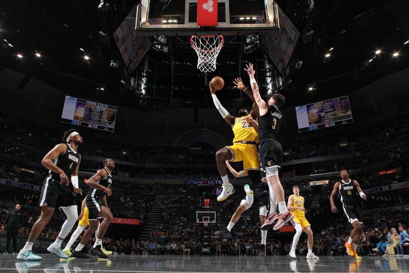 MEMPHIS, TN - APRIL 12: LeBron James #23 of the Los Angeles Lakers drives to the basket during the game against the Memphis Grizzlies on April 12, 2024 at FedExForum in Memphis, Tennessee. NOTE TO USER: User expressly acknowledges and agrees that, by downloading and or using this photograph, User is consenting to the terms and conditions of the Getty Images License Agreement. Mandatory Copyright Notice: Copyright 2024 NBAE (Photo by Joe Murphy/NBAE via Getty Images)