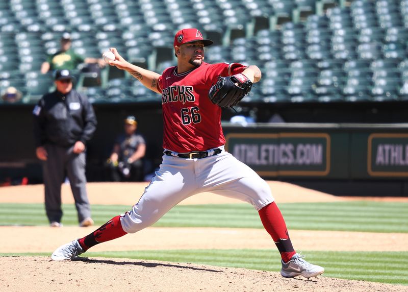 May 17, 2023; Oakland, California, USA; Arizona Diamondbacks relief pitcher Jose Ruiz (66) pitches the ball Oakland Athletics during the eighth inning at Oakland-Alameda County Coliseum. Mandatory Credit: Kelley L Cox-USA TODAY Sports