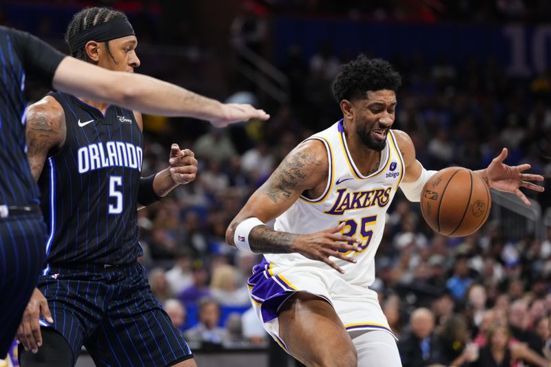 ORLANDO, FLORIDA - NOVEMBER 04: Christian Wood #35 of the Los Angeles Lakers drives to the basket against the Orlando Magic during the game at Amway Center on November 04, 2023 in Orlando, Florida. NOTE TO USER: User expressly acknowledges and agrees that, by downloading and or using this photograph, User is consenting to the terms and conditions of the Getty Images License Agreement. (Photo by Rich Storry/Getty Images)