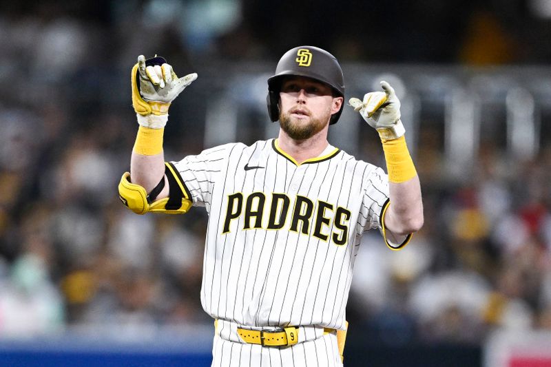 May 14, 2025; San Diego, California, USA; San Diego Padres second baseman Jake Cronenworth (9) gestures after hititng a double during the fourth inning against the Los Angeles Angels at Petco Park. Mandatory Credit: Denis Poroy-Imagn Images