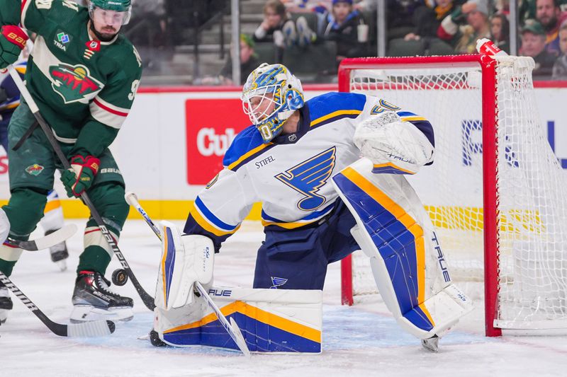 Nov 28, 2023; Saint Paul, Minnesota, USA; St. Louis Blues goaltender Jordan Binnington (50) makes a save against the Minnesota Wild in the second period at Xcel Energy Center. Mandatory Credit: Brad Rempel-USA TODAY Sports