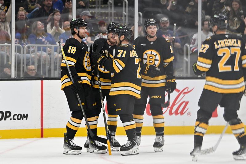 Oct 4, 2025; Boston, Massachusetts, USA; Boston Bruins center Pavel Zacha (18) (l) celebrates a goal against the New York Rangers with teammates during the first period at TD Garden. Mandatory Credit: Eric Canha-Imagn Images
