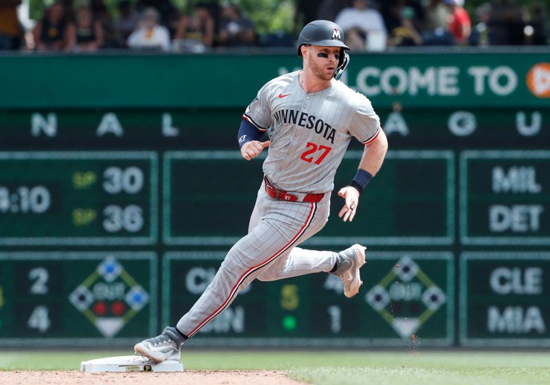 Jun 9, 2024; Pittsburgh, Pennsylvania, USA; Minnesota Twins catcher Ryan Jeffers (27) advances to second base after wild pitch by the Pittsburgh Pirates during the sixth inning at PNC Park. Mandatory Credit: Charles LeClaire-USA TODAY Sports