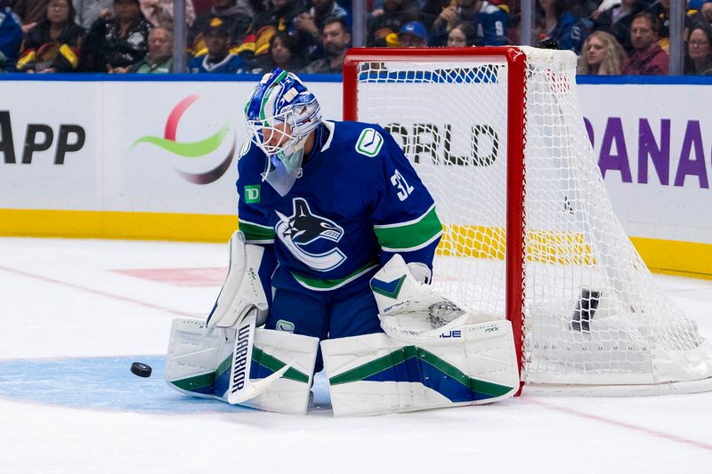 Oct 11, 2024; Vancouver, British Columbia, CAN;  Vancouver Canucks goalie Kevin Lankinen (32) makes a save against the Philadelphia Flyers during the second period at Rogers Arena. Mandatory Credit: Bob Frid-Imagn Images