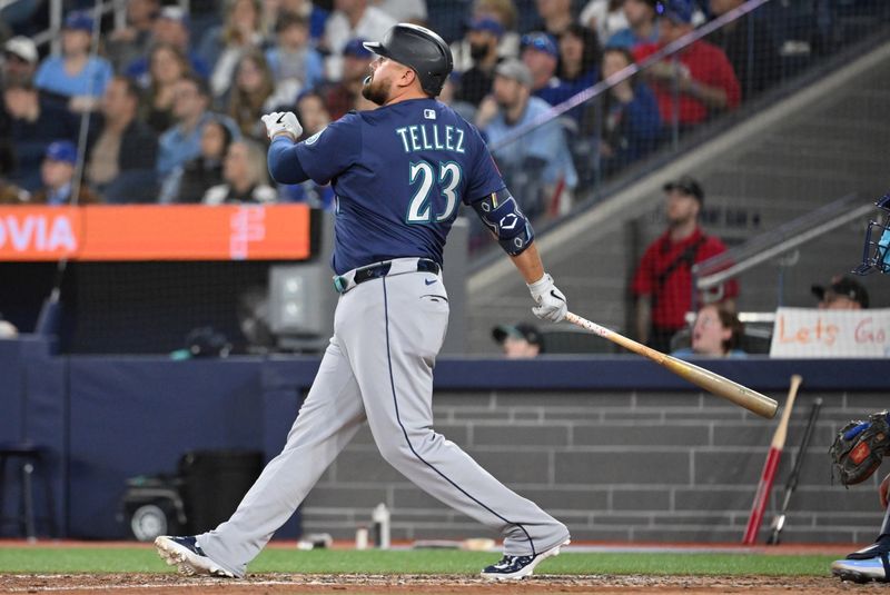 Apr 20, 2025; Toronto, Ontario, CAN;  Seattle Mariners first baseman Rowdy Tellez (23) hits a two run home run against the Toronto Blue Jays in the seventh inning at Rogers Centre. Mandatory Credit: Dan Hamilton-Imagn Images
