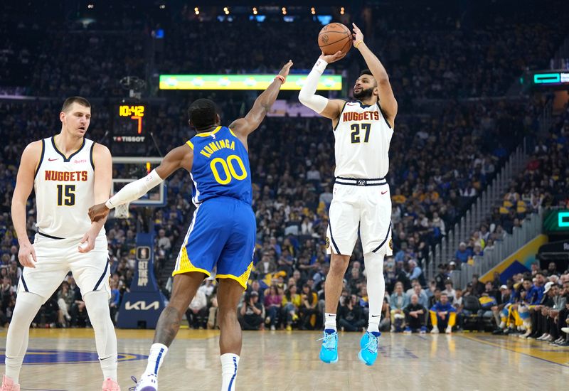 SAN FRANCISCO, CALIFORNIA - FEBRUARY 25: Jamal Murray #27 of the Denver Nuggets shoots over Jonathan Kuminga #00 of the Golden State Warriors during the first quarter of an NBA basketball game at Chase Center on February 25, 2024 in San Francisco, California. NOTE TO USER: User expressly acknowledges and agrees that, by downloading and or using this photograph, User is consenting to the terms and conditions of the Getty Images License Agreement. (Photo by Thearon W. Henderson/Getty Images)