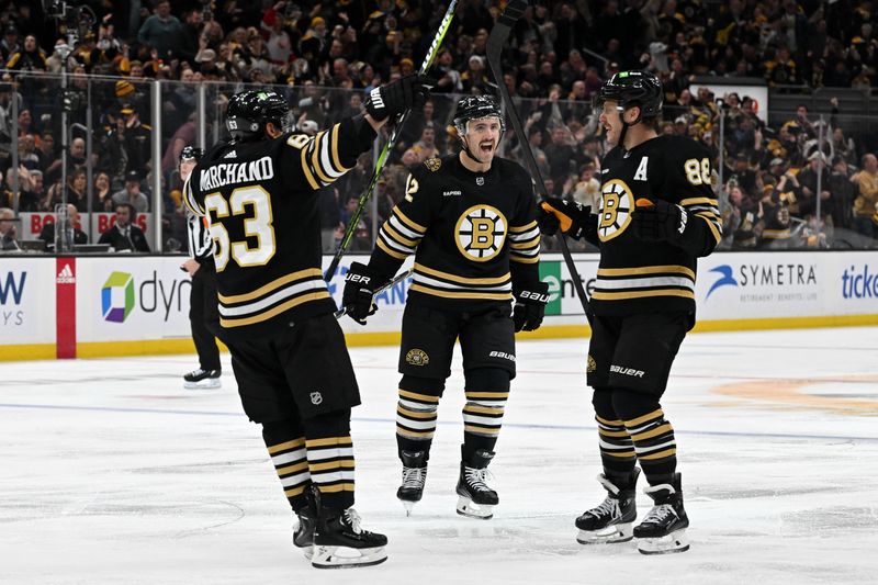 Nov 9, 2023; Boston, Massachusetts, USA; Boston Bruins right wing David Pastrnak (88) celebrates with left wing Brad Marchand (63) and defenseman Kevin Shattenkirk (12) after scoring a goal against the New York Islanders during the third period at the TD Garden. Mandatory Credit: Brian Fluharty-USA TODAY Sports