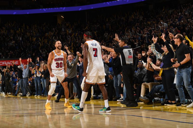 SAN FRANCISCO, CA - DECEMBER 8:  Stephen Curry #30 and Buddy Hield #7 of the Golden State Warriors celebrates during the game against the Minnesota Timberwolves during a regular season game on December 8, 2024 at Chase Center in San Francisco, California. NOTE TO USER: User expressly acknowledges and agrees that, by downloading and or using this photograph, user is consenting to the terms and conditions of Getty Images License Agreement. Mandatory Copyright Notice: Copyright 2024 NBAE (Photo by Noah Graham/NBAE via Getty Images)