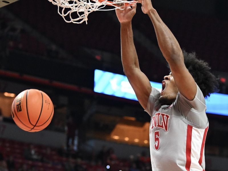 Jan 13, 2024; Las Vegas, Nevada, USA; UNLV Rebels forward Rob Whaley Jr. (5) dunks on the Utah State Aggies in the first half at Thomas & Mack Center. Mandatory Credit: Candice Ward-USA TODAY Sports