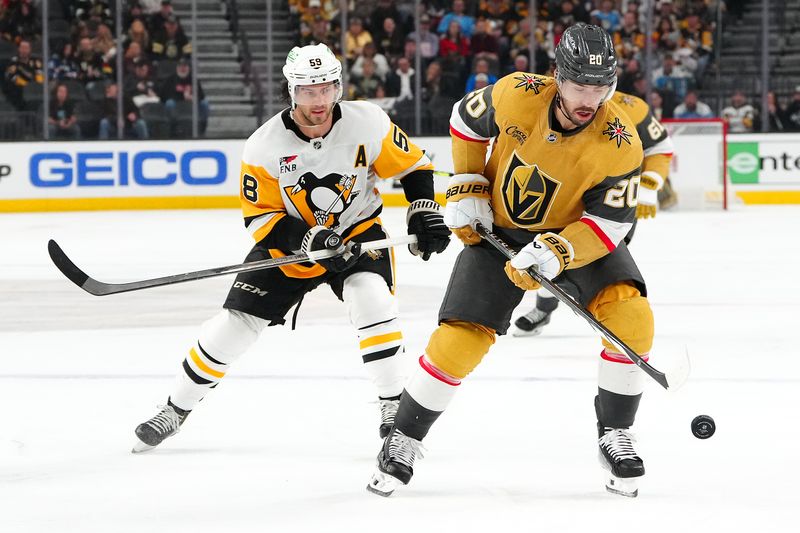 Jan 20, 2024; Las Vegas, Nevada, USA; Vegas Golden Knights center Chandler Stephenson (20) controls the puck ahead of Pittsburgh Penguins left wing Jake Guentzel (59) during the third period at T-Mobile Arena. Mandatory Credit: Stephen R. Sylvanie-USA TODAY Sports