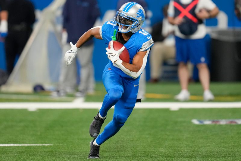 Detroit Lions wide receiver Kalif Raymond (11) returns a punt during the second half of an NFL football game against the Tennessee Titans, Sunday, Oct. 27, 2024, in Detroit. (AP Photo/Paul Sancya)