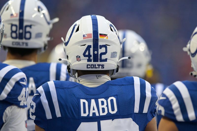 The United States and German flag logos are on the helmet Indianapolis Colts cornerback Marcel Dabo (42) before an NFL preseason preseason football game against the Tampa Bay Buccaneers in Indianapolis, Saturday, Aug. 27, 2022. (AP Photo/Doug McSchooler)