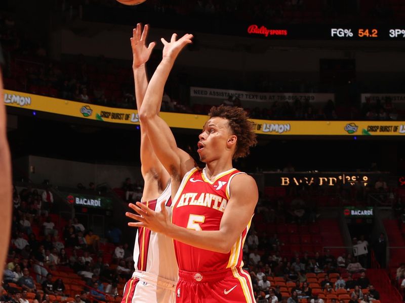 MIAMI, FL - OCTOBER 16: Dyson Daniels #5 of the Atlanta Hawks shoots the ball during the game against the Miami Heat on October 16, 2024 at Miami-Dade Arena in Miami, Florida. NOTE TO USER: User expressly acknowledges and agrees that, by downloading and or using this Photograph, user is consenting to the terms and conditions of the Getty Images License Agreement. Mandatory Copyright Notice: Copyright 2024 NBAE (Photo by Issac Baldizon/NBAE via Getty Images)