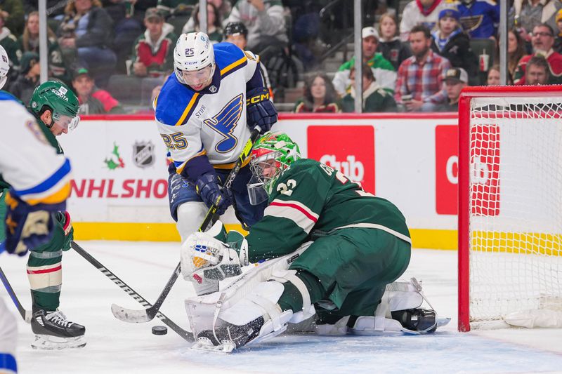 Nov 28, 2023; Saint Paul, Minnesota, USA; St. Louis Blues center Jordan Kyrou (25) shoots against the Minnesota Wild goaltender Filip Gustavsson (32) in the third period at Xcel Energy Center. Mandatory Credit: Brad Rempel-USA TODAY Sports