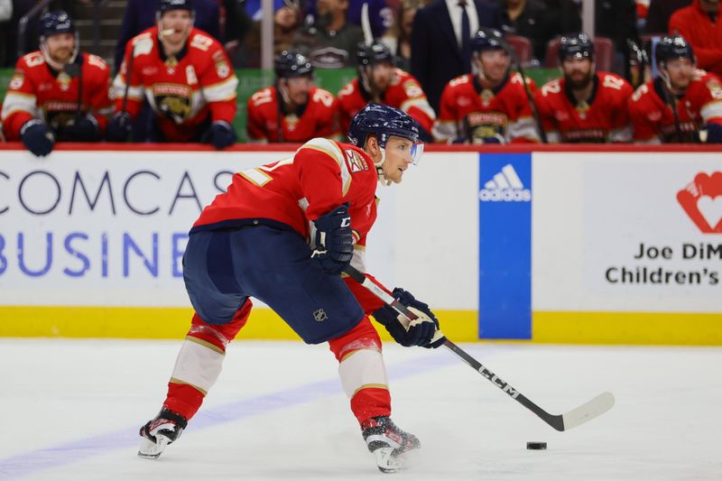 Apr 16, 2024; Sunrise, Florida, USA; Florida Panthers defenseman Gustav Forsling (42) controls the puck against the Toronto Maple Leafs during the second period at Amerant Bank Arena. Mandatory Credit: Sam Navarro-USA TODAY Sports