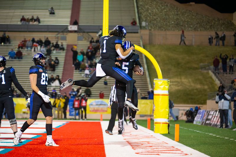 Dec 17, 2022; Albuquerque, New Mexico, USA; Brigham Young Cougars quarterback Sol-Jay Maiava-Peters (5) celebrates with wide receiver Keanu Hill (1) after a running touchdown against the Southern Methodist Mustangs during the first half at University Stadium (Albuquerque). Mandatory Credit: Ivan Pierre Aguirre-USA TODAY Sports