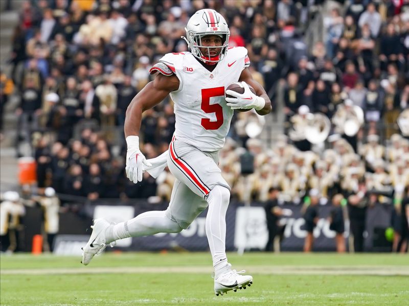 Oct 14, 2023; West Lafayette, Indiana, USA;  Ohio State Buckeyes running back Dallan Hayden (5) runs the ball during the first half at Ross-Ade Stadium. Mandatory Credit: Robert Goddin-USA TODAY Sports