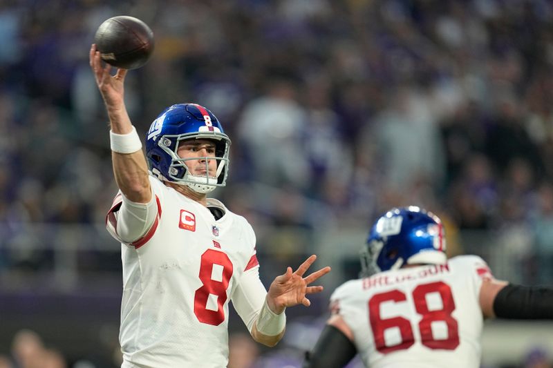 New York Giants quarterback Daniel Jones (8) passes during the first half of an NFL wild-card football game against the Minnesota Vikings, Sunday, Jan. 15, 2023, in Minneapolis. (AP Photo/Abbie Parr)