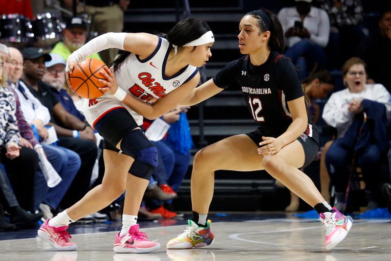 Feb 19, 2023; Oxford, Mississippi, USA; Mississippi Rebels guard Elauna Eaton (23) handles the ball against South Carolina Gamecocks guard Brea Beal (12) during the second half at The Sandy and John Black Pavilion at Ole Miss. Mandatory Credit: Petre Thomas-USA TODAY Sports