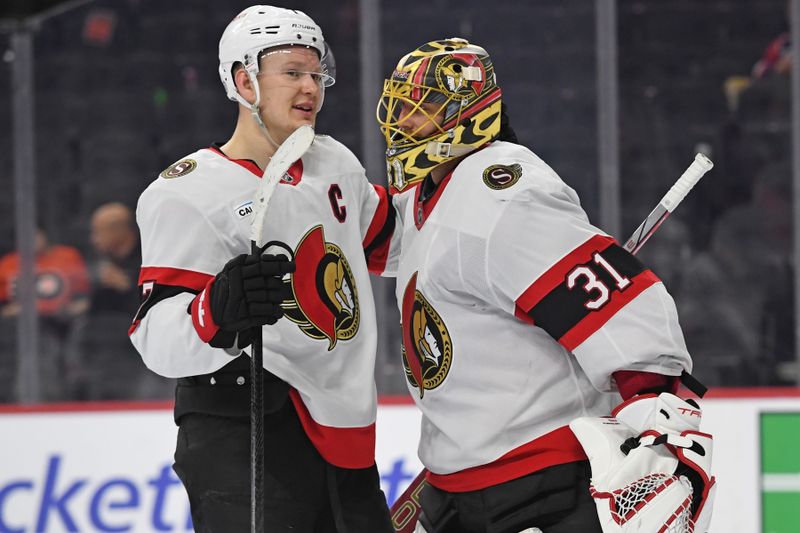 Mar 11, 2025; Philadelphia, Pennsylvania, USA; Ottawa Senators left wing Brady Tkachuk (7) and goaltender Anton Forsberg (31) celebrate win against the Philadelphia Flyers at Wells Fargo Center. Mandatory Credit: Eric Hartline-Imagn Images