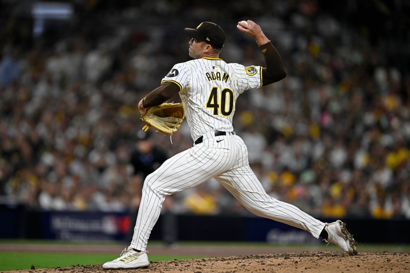 Oct 1, 2024; San Diego, California, USA; San Diego Padres pitcher Jason Adam (40) throws a pitch against the Atlanta Braves during the eighth inning in game one of the Wildcard round for the 2024 MLB Playoffs at Petco Park. Mandatory Credit: Denis Poroy-Imagn Images