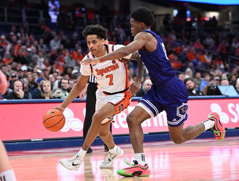 Dec 22, 2025; Syracuse, New York, USA; Syracuse Orange guard Kiyan Anthony (7) handles the ball against Stonehill Skyhawks guard Hermann Kooffi (10) in the second half at the JMA Wireless Dome. Mandatory Credit: Mark Konezny-Imagn Images
