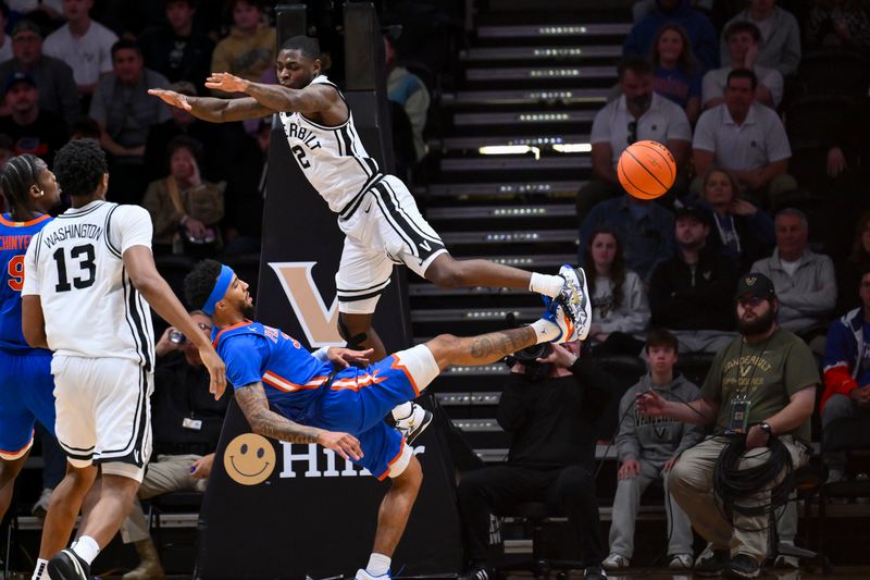 Jan 17, 2026; Nashville, Tennessee, USA;  Florida Gators guard Boogie Fland (33) passes the ball as Vanderbilt Commodores guard Duke Miles (2) fouls him during the second half at Memorial Gymnasium. Mandatory Credit: Steve Roberts-Imagn Images