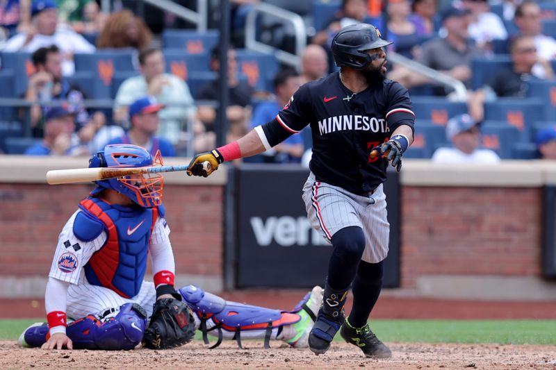 Jul 31, 2024; New York City, New York, USA; Minnesota Twins first baseman Carlos Santana (30) follows through on an RBI double against the New York Mets during the fifth inning at Citi Field. Mandatory Credit: Brad Penner-USA TODAY Sports