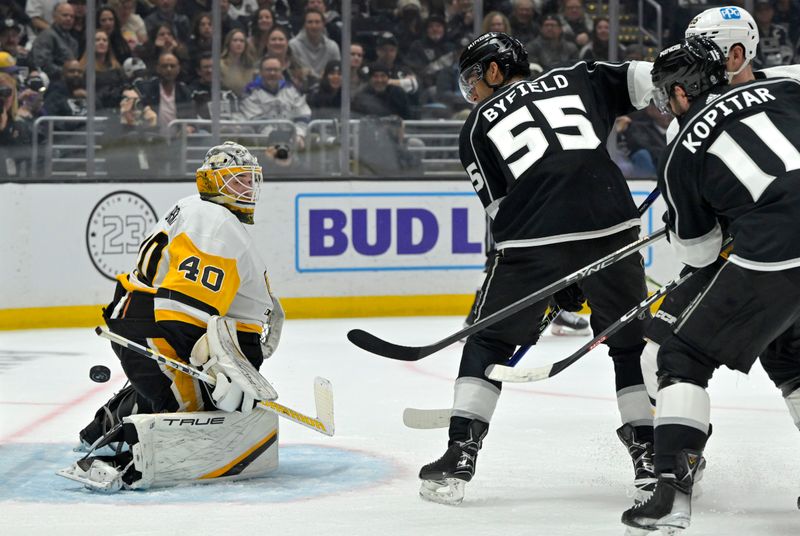 Feb 11, 2023; Los Angeles, California, USA;  Pittsburgh Penguins goaltender Dustin Tokarski (40) deflects a shot by Los Angeles Kings center Quinton Byfield (55) in the second period at Crypto.com Arena. Mandatory Credit: Jayne Kamin-Oncea-USA TODAY Sports