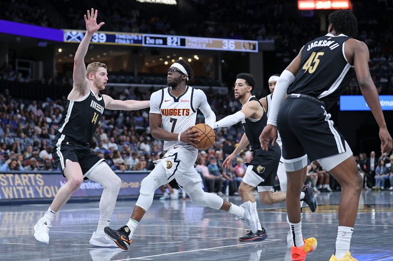 MEMPHIS, TENNESSEE - APRIL 14: Reggie Jackson #7 of the Denver Nuggets goes to the basket during the first half against the Memphis Grizzlies at FedExForum on April 14, 2024 in Memphis, Tennessee. NOTE TO USER: User expressly acknowledges and agrees that, by downloading and or using this photograph, User is consenting to the terms and conditions of the Getty Images License Agreement. (Photo by Justin Ford/Getty Images)