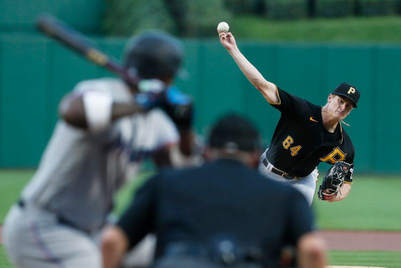 Sep 30, 2023; Pittsburgh, Pennsylvania, USA; Pittsburgh Pirates starting pitcher Quinn Priester (64) delivers a pitch to Miami Marlins designated hitter Jorge Soler (12) during the first inning at PNC Park. Mandatory Credit: Charles LeClaire-USA TODAY Sports