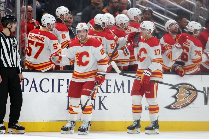 Dec 21, 2023; Anaheim, California, USA;  Calgary Flames center Elias Lindholm (28) celebrates with teammates after scoring a goal during the second period against the Anaheim Ducks at Honda Center. Mandatory Credit: Kiyoshi Mio-USA TODAY Sports