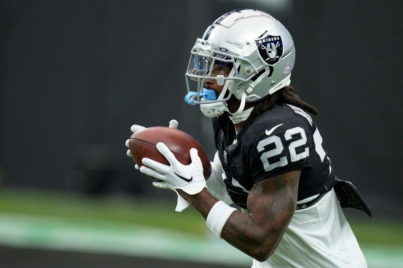 Las Vegas Raiders running back Ameer Abdullah (22) warms up before an NFL football game against the New England Patriots, Sunday, Oct. 15, 2023, in Las Vegas. (AP Photo/John Locher)